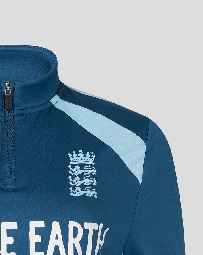 Close up of blue training midlayer chest showing England crest and Whole Earth logo.