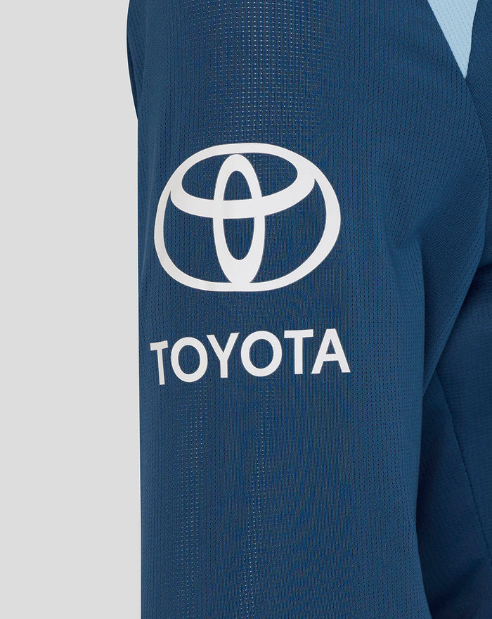 Close-up of blue training long sleeve showing Toyota sponsor logo on the sleeve