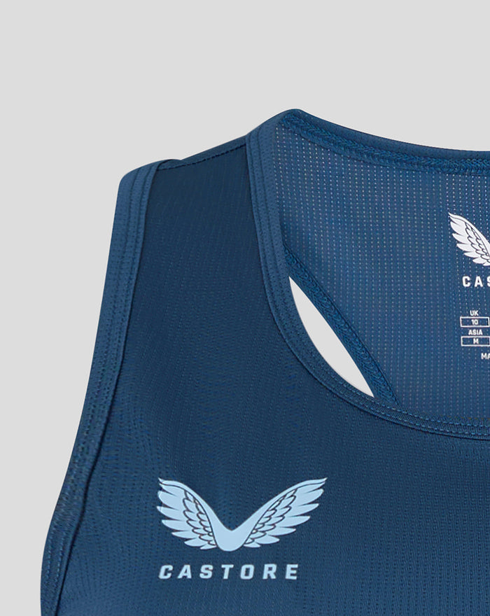 Close-up of shoulder area of Ensign Blue training racer back showing Castore logo.