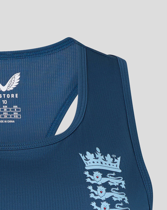 Close-up of blue sleeveless training top shoulder with England crest and Castore branding