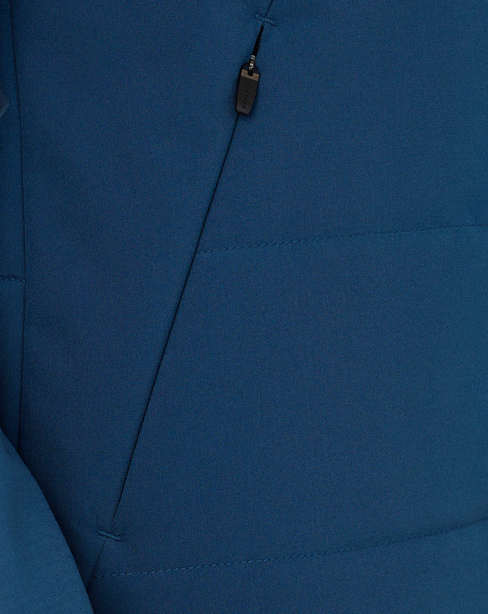 Detail of Ensign Blue Training Thermal Jacket fabric with diagonal zip and pull tab.