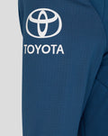Close-up of Ensign Blue Training Thermal Jacket fabric featuring a Toyota logo.