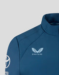 Close up of the blue jacket chest with Castore emblem featuring a wing design and Toyota branding on the sleeve