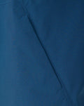 Close-up of blue fabric with seam on the Training Rain Jacket