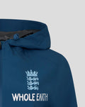 Front view of blue Ensign Training Rain Jacket with Whole Earth crest on the chest