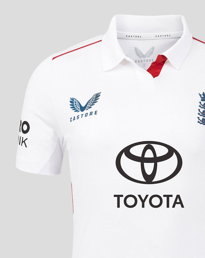 Close-up of white England Women's Test Pro cricket shirt front showing England crest Castore branding and Toyota logo