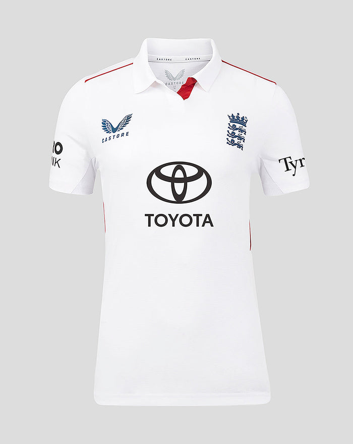 Front view of white England women's Test cricket short sleeve shirt with navy crest and Toyota sponsor