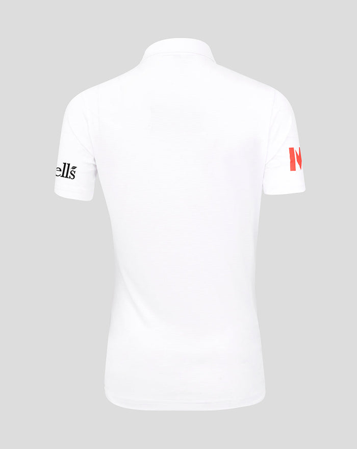 Close up of a white England Test shirt collar showing red placket detail and inner Castore branding.