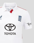 White England women's Test cricket shirt featuring navy Castore crest on left chest, England crest on right, Toyota sponsor, and red shoulder piping.