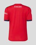 Rear view of red women's T20 cricket jersey with Emirates branding across the upper back