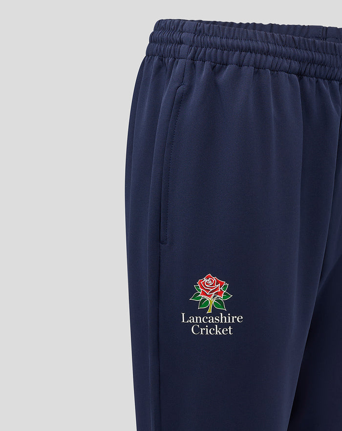 Close up of navy Lancashire Track Pant showing the embroidered Lancashire Cricket crest on the leg