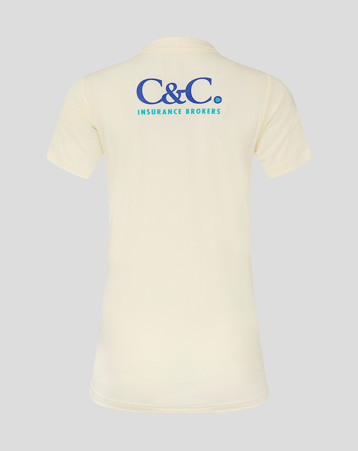 Cream jersey back view with C&C Insurance Brokers logo across the upper back