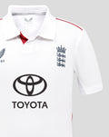 Close-up of chest area on a white England Test shirt showing the crest and Toyota logo.
