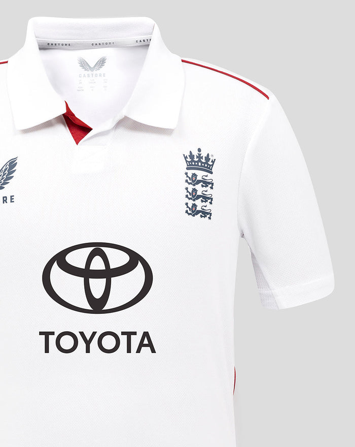 Close-up of chest area on a white England Test shirt showing the crest and Toyota logo.