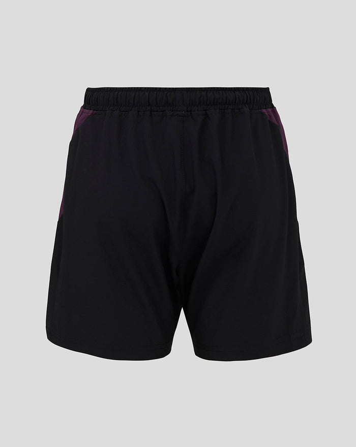 Back view of England Cricket junior training shorts in black with purple side panels and an elastic waistband