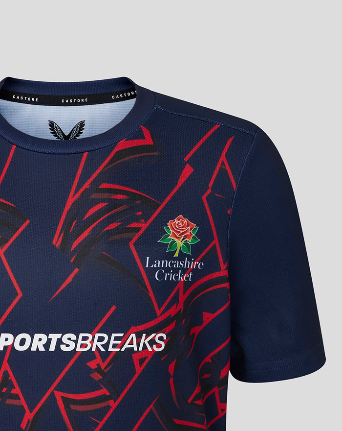 Junior 26/27 Short Sleeve Performance T-Shirt in peacoat navy with red geometric graphics and Lancashire Cricket rose crest on chest