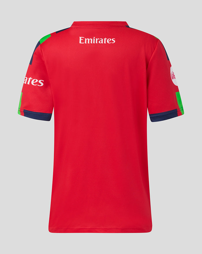 Back view of red junior T20 short sleeve jersey with Emirates branding across the upper back and colorful sleeve accents