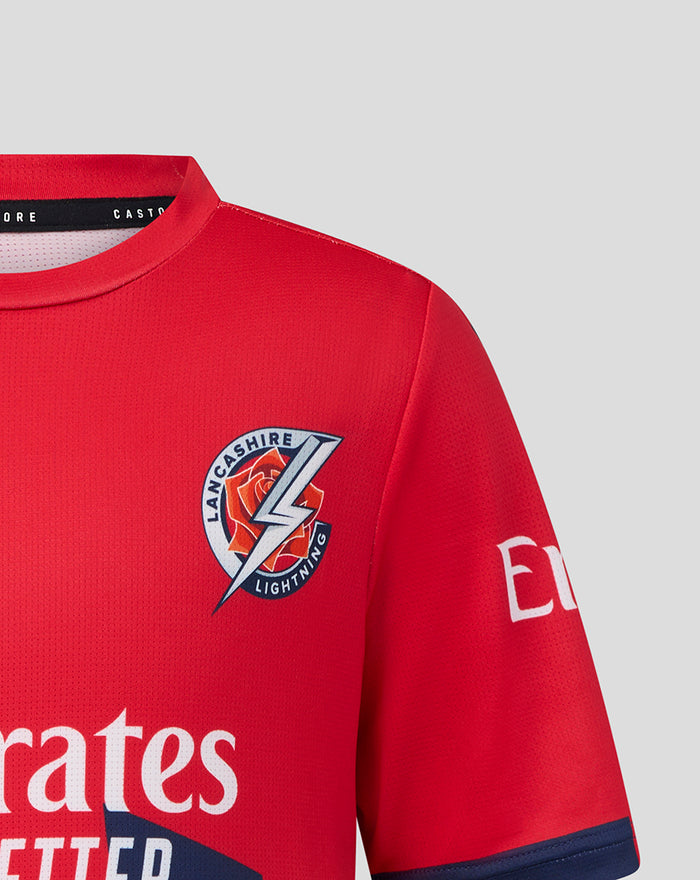 Junior red T20 short sleeve cricket jersey with Lancashire Lightning crest on the chest and Emirates sponsor logo