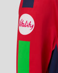 Red junior T20 jersey sleeve close up with a white Vitality circular logo and a bright green panel