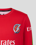 Front close up of red Junior 26/27 T20 Long Sleeve Jersey with Lancashire Lightning crest and Emirates sponsor.