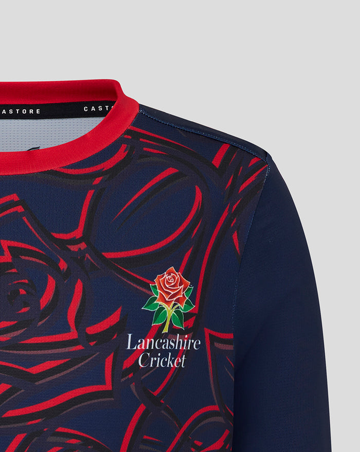 Front view of navy Junior One Day Jersey in Peacoat with bold red rose pattern, Lancashire Cricket crest on chest and Castore branding