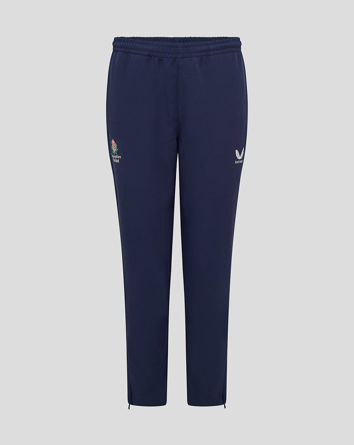 Front view of junior navy Lancashire track pants with the Lancashire Cricket crest on the left thigh