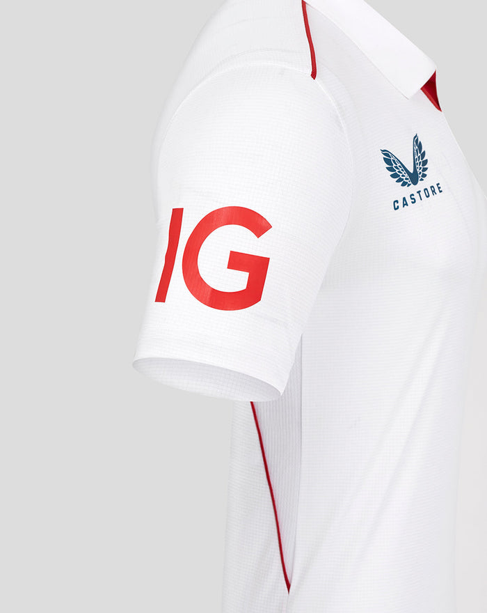 Side view of white England Test Pro short sleeve cricket shirt with red piping and large red IG on the sleeve.