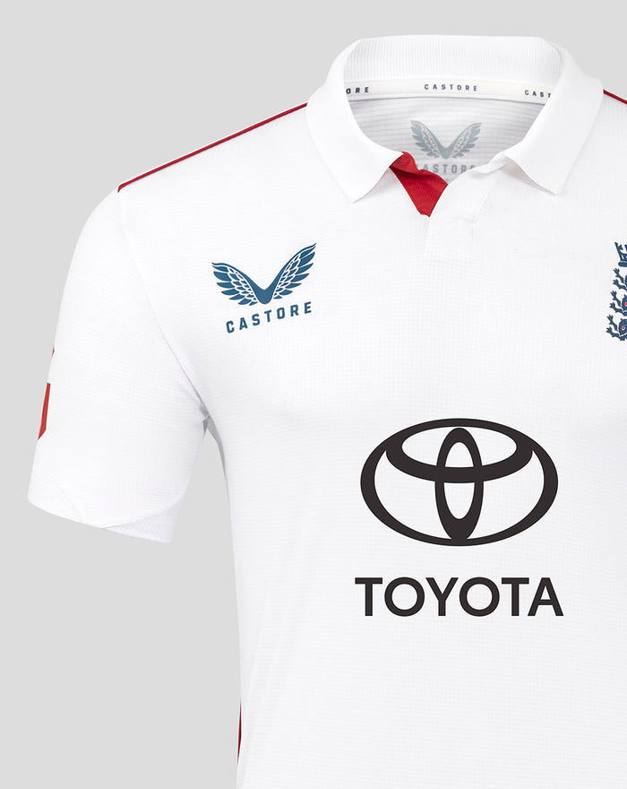 Front view of white England Test Pro shirt with Castore crest, England lions emblem, red piping, and Toyota logo.