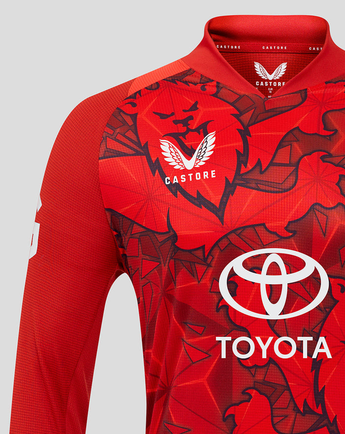 Close-up of red England T20 Pro shirt chest area with Three Lions crest Castore branding and Toyota logo