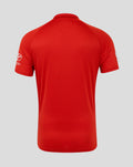 Rear view of red shirt sleeve with Toyota logo and curved hem
