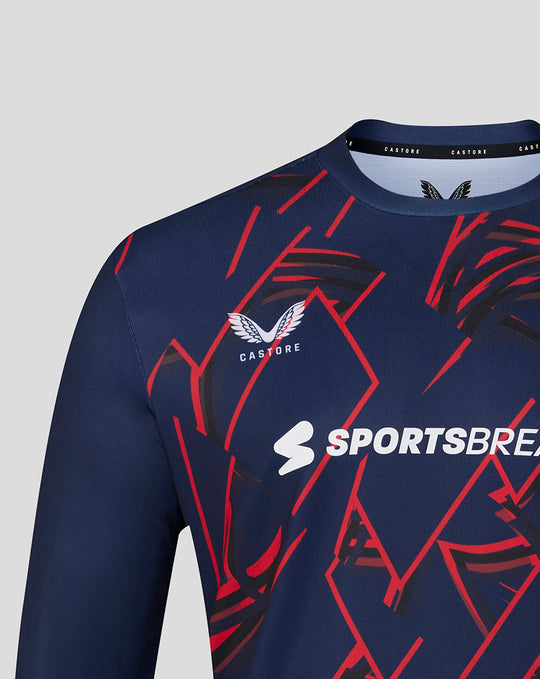 Navy long sleeve performance T shirt with bold red geometric pattern and Castore Sportsbreaks branding