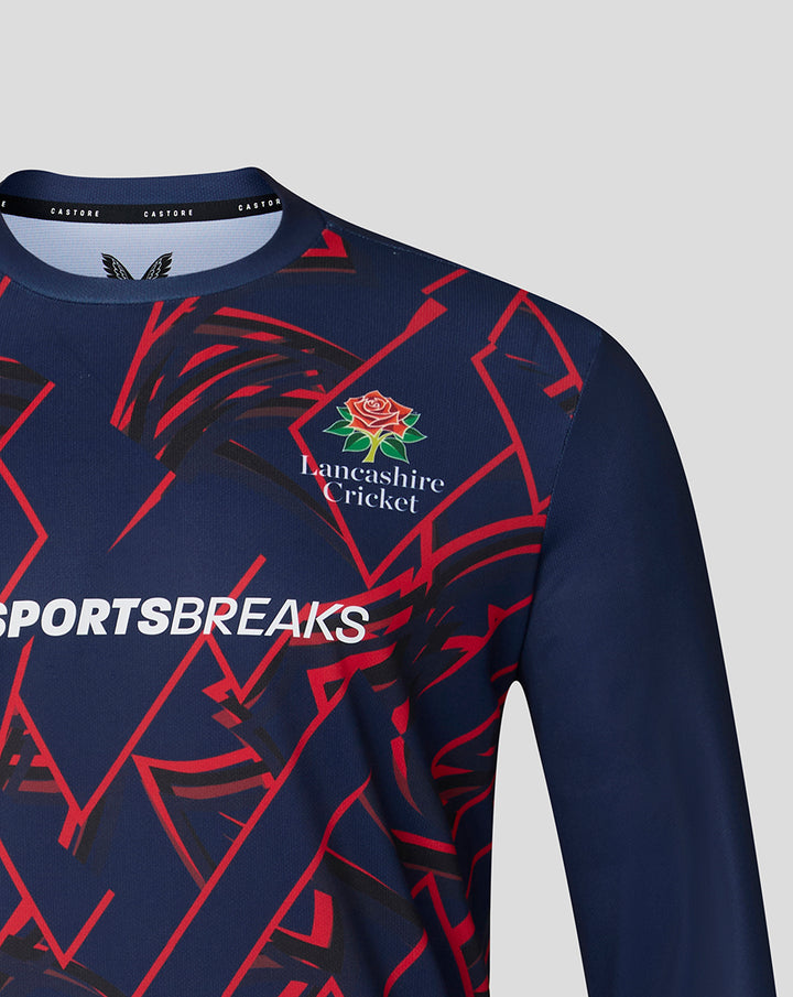 Navy long sleeve performance T shirt close up showing Lancashire Cricket rose crest and red geometric pattern