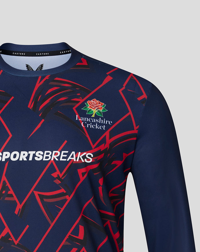 Navy long sleeve performance T shirt close up showing Lancashire Cricket rose crest and red geometric pattern