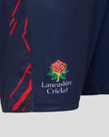 Close-up of navy shorts showing the Lancashire Cricket crest and red side graphics.