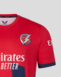 Red T20 jersey showing Lancashire Lightning crest on the chest and Emirates Fly Better slogan across the front.