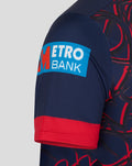 Navy short sleeve jersey with a bright Metro Bank logo patch on the sleeve and a red cuff.