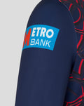 Close-up of a bright blue Metro Bank patch on the navy sleeve.