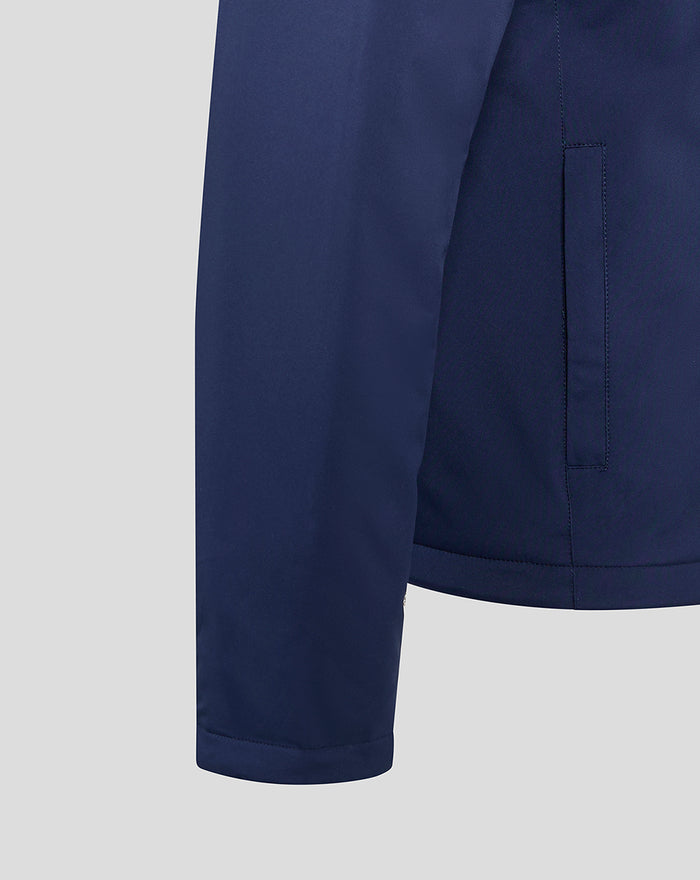 Side view of navy Lancashire bench jacket showing pocket seam and curved hem