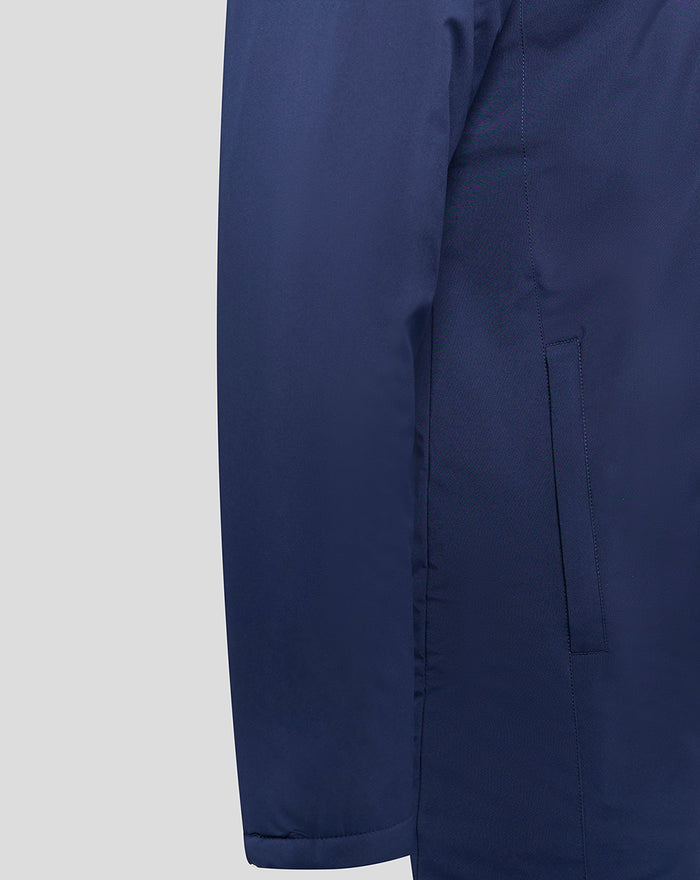Close up of navy Lancashire long bench jacket with a vertical side pocket.