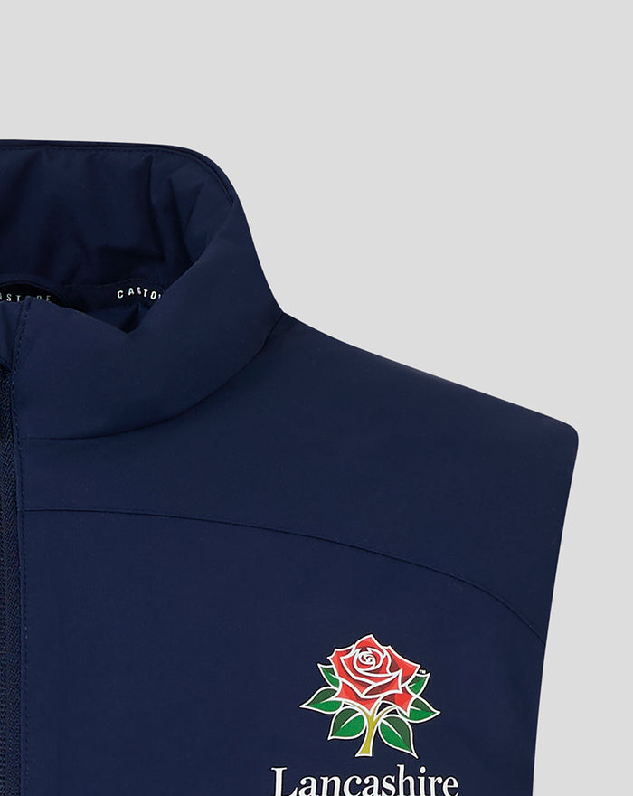 Navy padded gilet close up with high collar and Lancashire crest